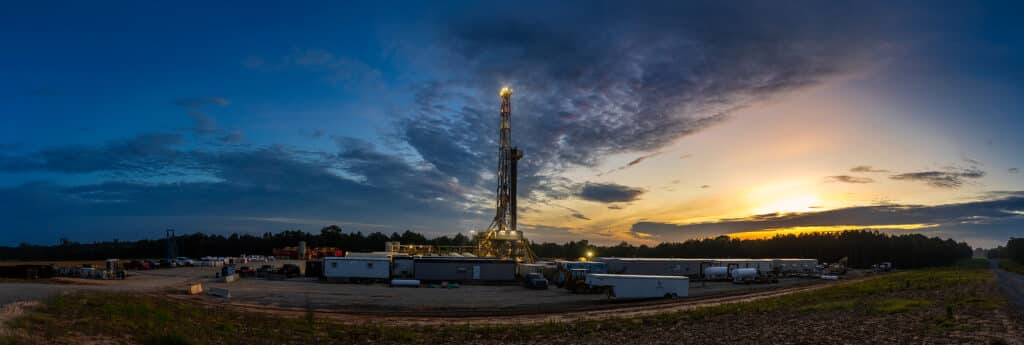 Panoramic view of an active gas drilling site near Carthage, Texas, captured at sunrise for oil and gas photography by Solaris Studios.