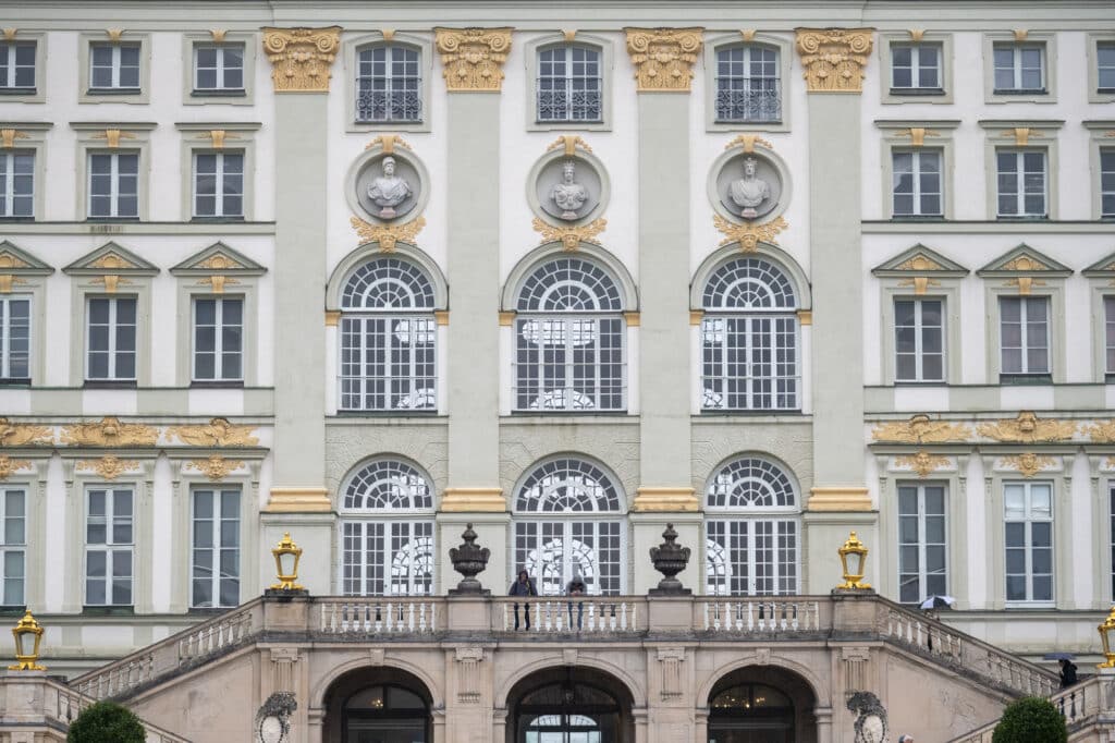 Detailed view of the back façade of Nymphenburg Palace in Munich, captured during a light rain with the Bevis Gear bag allowing fast, unobtrusive shooting in a refined setting.