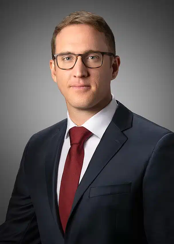 Professional headshot before and after retouching, eyeglass glare removal demonstration