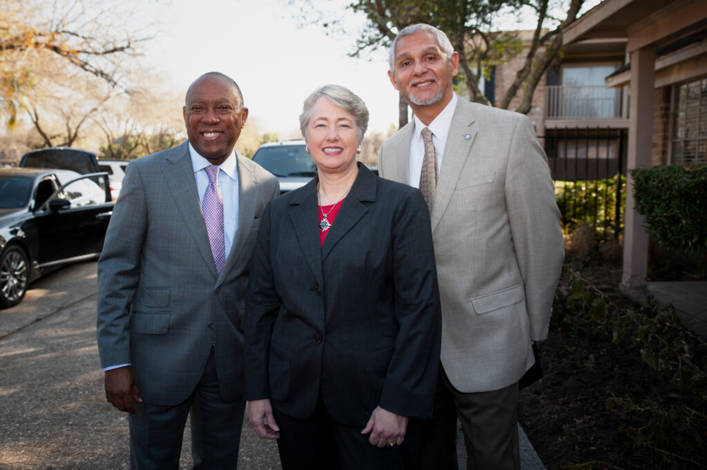 Group portrait of former Houston Mayor Sylvester Turner, former Houston Mayor Kathy Whitmire, and Houston City Council Member Robert Gallegos outdoors at a civic event in Houston.